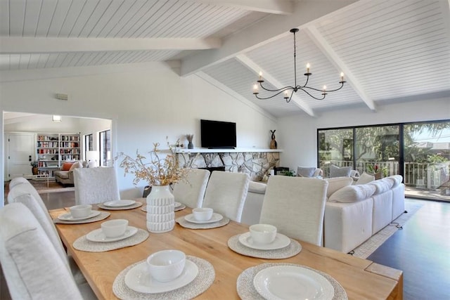 2103 Benson Ave, Cambria, CA 93428 - dining space with a chandelier, wood finished floors, a stone fireplace, and wooden ceiling