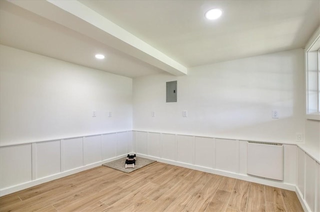 2103 Benson Ave, Cambria, CA 93428 - empty room featuring electric panel, light wood-type flooring, recessed lighting, a wainscoted wall, and a decorative wall