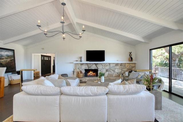 2103 Benson Ave, Cambria, CA 93428 - living room featuring a chandelier, wood finished floors, and a stone fireplace