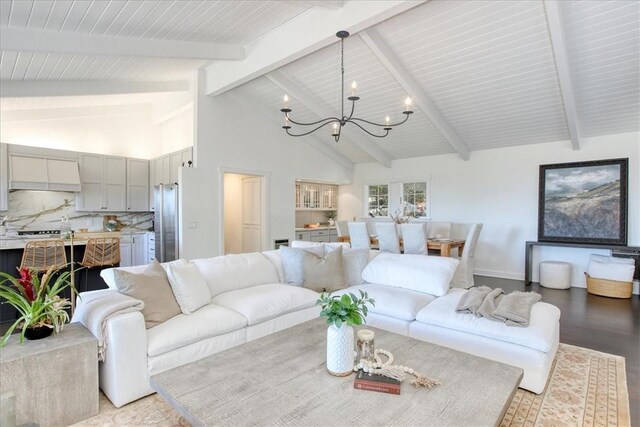 2103 Benson Ave, Cambria, CA 93428 - living area featuring a chandelier, beamed ceiling, light wood-style floors, and high vaulted ceiling