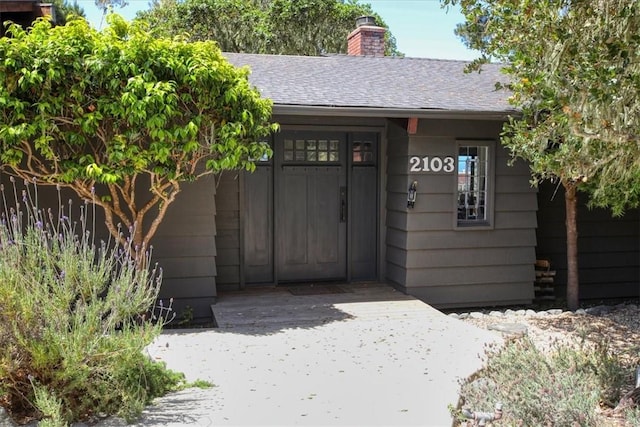 2103 Benson Ave, Cambria, CA 93428 - doorway to property featuring a chimney and a shingled roof