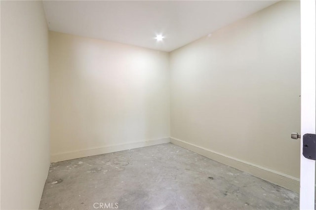 3264 E Holt Ave, West Covina, CA 91791 - spare room with baseboards and unfinished concrete flooring