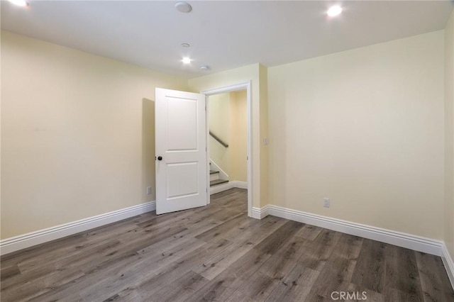 3264 E Holt Ave, West Covina, CA 91791 - unfurnished room with wood finished floors, recessed lighting, and stairs