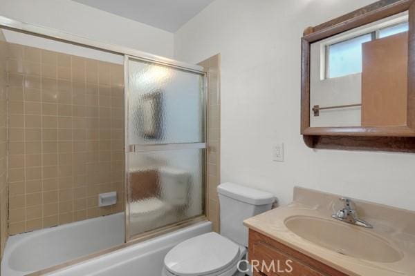 3014 E 3rd St, Los Angeles, CA 90033 - bathroom with vanity and bath / shower combo with glass door