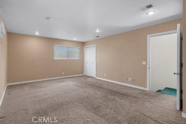 3014 E 3rd St, Los Angeles, CA 90033 - carpeted spare room with baseboards and recessed lighting