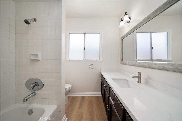 2458 W Marian Ave, Anaheim, CA 92804 - bathroom featuring vanity, wood finished floors, and washtub / shower combination
