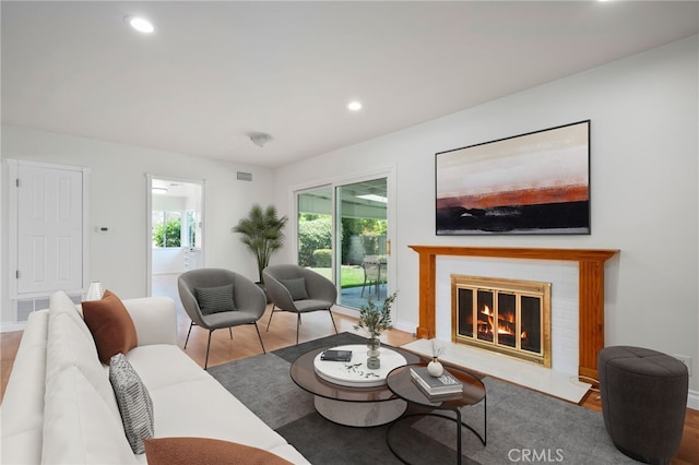 2458 W Marian Ave, Anaheim, CA 92804 - living room featuring wood finished floors, a fireplace, and recessed lighting