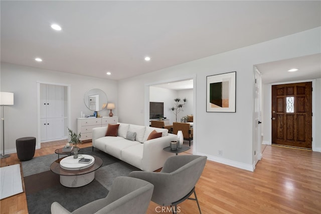 2458 W Marian Ave, Anaheim, CA 92804 - living room featuring light wood-type flooring and recessed lighting