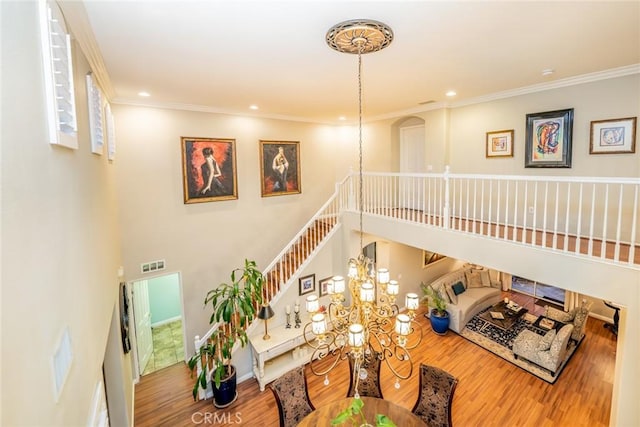 3141 Brunstane Cir, Corona, CA 92882 - living area featuring wood finished floors, recessed lighting, ornamental molding, and a chandelier