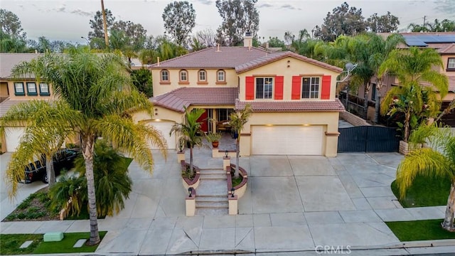 3141 Brunstane Cir, Corona, CA 92882 - mediterranean / spanish-style home with driveway, stucco siding, a chimney, a tile roof, and an attached garage