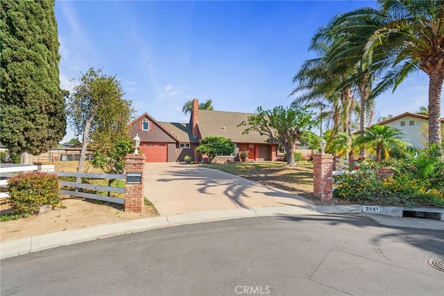 2041 Caballeros Rd, Norco, CA 92860 - view of property hidden behind natural elements featuring concrete driveway and stucco siding