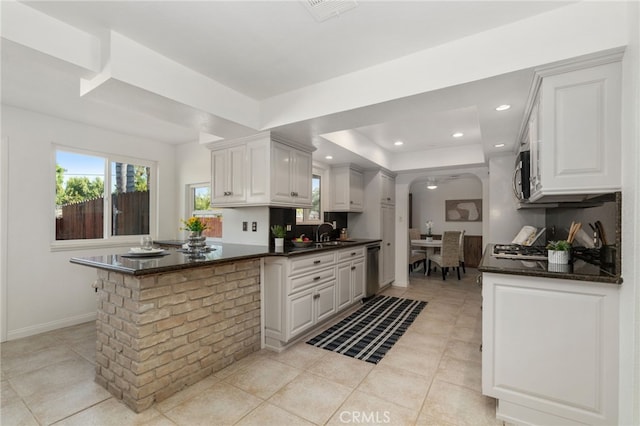 2041 Caballeros Rd, Norco, CA 92860 - kitchen featuring a peninsula, a tray ceiling, white cabinets, recessed lighting, and light tile patterned floors