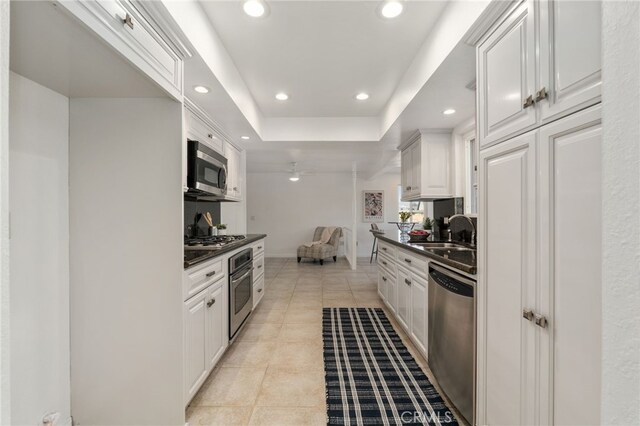 2041 Caballeros Rd, Norco, CA 92860 - kitchen featuring stainless steel appliances, dark countertops, recessed lighting, light tile patterned floors, and white cabinets