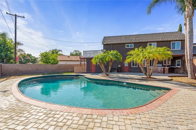 2041 Caballeros Rd, Norco, CA 92860 - view of swimming pool with a fenced backyard and a patio area