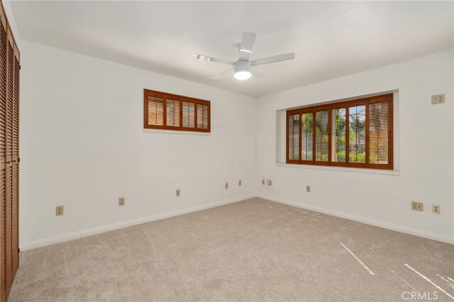2041 Caballeros Rd, Norco, CA 92860 - unfurnished bedroom featuring light carpet, ceiling fan, and a closet