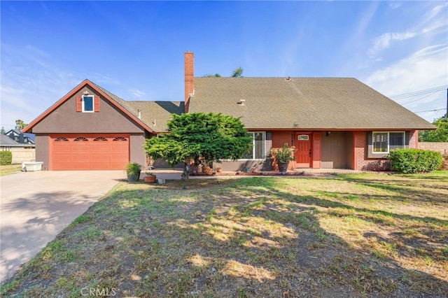 2041 Caballeros Rd, Norco, CA 92860 - view of front of property featuring concrete driveway, a chimney, brick siding, and a front yard