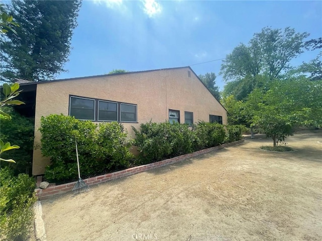7891 Minnesota Rd, Corona, CA 92881 - view of side of home with stucco siding
