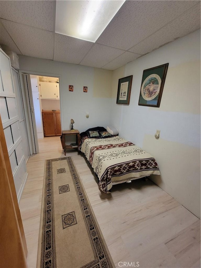 5566 Oleta Rd, Landers, CA 92285 - bedroom featuring a paneled ceiling and light wood finished floors