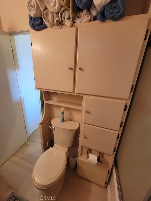 5566 Oleta Rd, Landers, CA 92285 - bathroom with wood finished floors and toilet