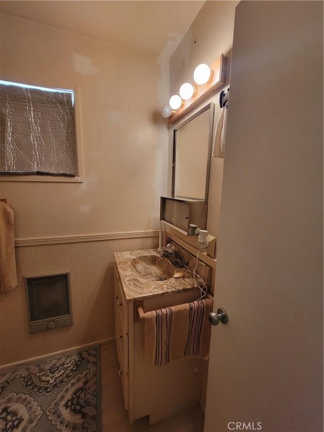 5566 Oleta Rd, Landers, CA 92285 - half bath with vanity, wainscoting, and heating unit