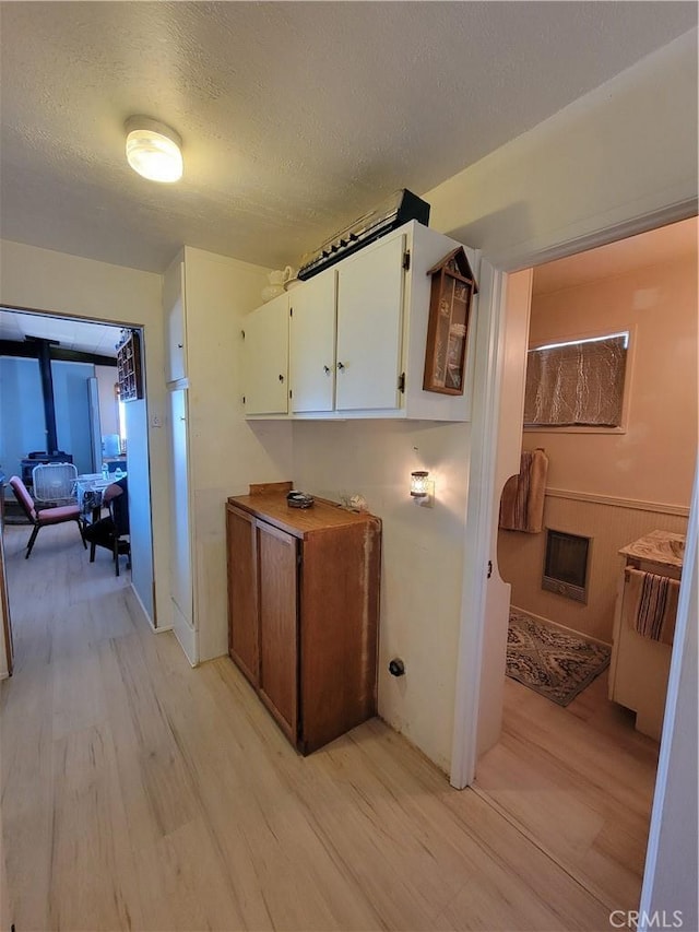 5566 Oleta Rd, Landers, CA 92285 - hall with light wood-type flooring and a textured ceiling