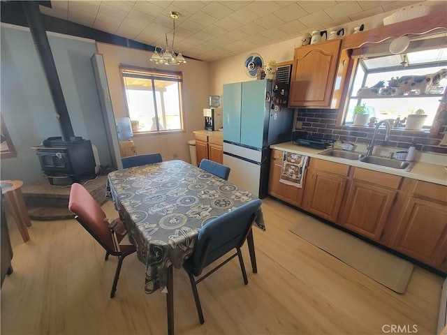 5566 Oleta Rd, Landers, CA 92285 - kitchen featuring freestanding refrigerator, plenty of natural light, light wood finished floors, and light countertops