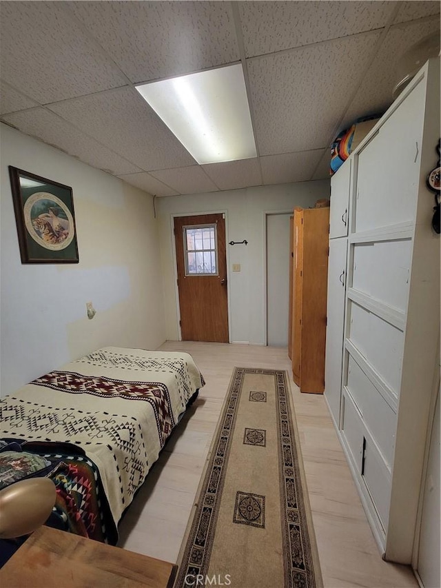 5566 Oleta Rd, Landers, CA 92285 - bedroom with a paneled ceiling and light wood-type flooring