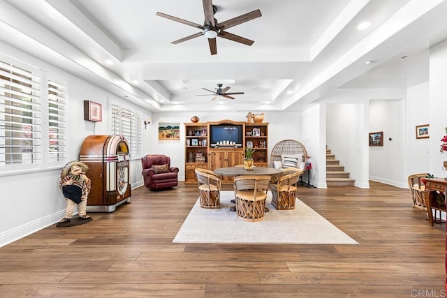 10166 Rancho Roble Rd, Escondido, CA 92026 - dining room featuring a ceiling fan, a tray ceiling, wood finished floors, recessed lighting, and stairs