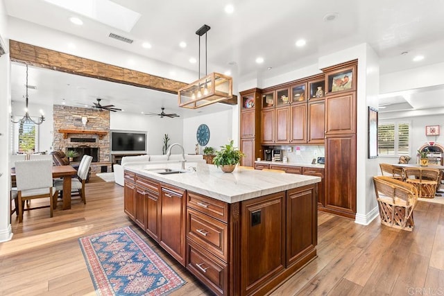 10166 Rancho Roble Rd, Escondido, CA 92026 - kitchen featuring a fireplace, plenty of natural light, open floor plan, light wood-style flooring, and recessed lighting