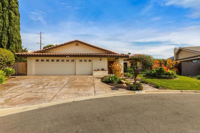 13837 Tam O Shanter Ct, Poway, CA 92064 - mediterranean / spanish-style home featuring brick siding, a tile roof, concrete driveway, and an attached garage