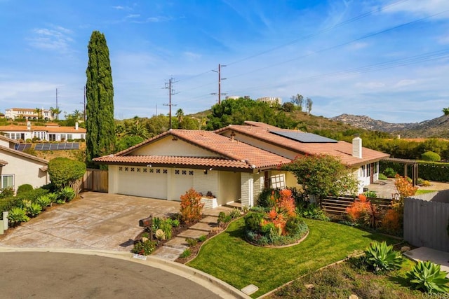 13837 Tam O Shanter Ct, Poway, CA 92064 - view of front facade with a tiled roof, an attached garage, concrete driveway, solar panels, and stucco siding