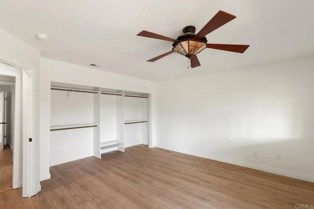 13837 Tam O Shanter Ct, Poway, CA 92064 - unfurnished bedroom featuring wood finished floors, a closet, and a ceiling fan
