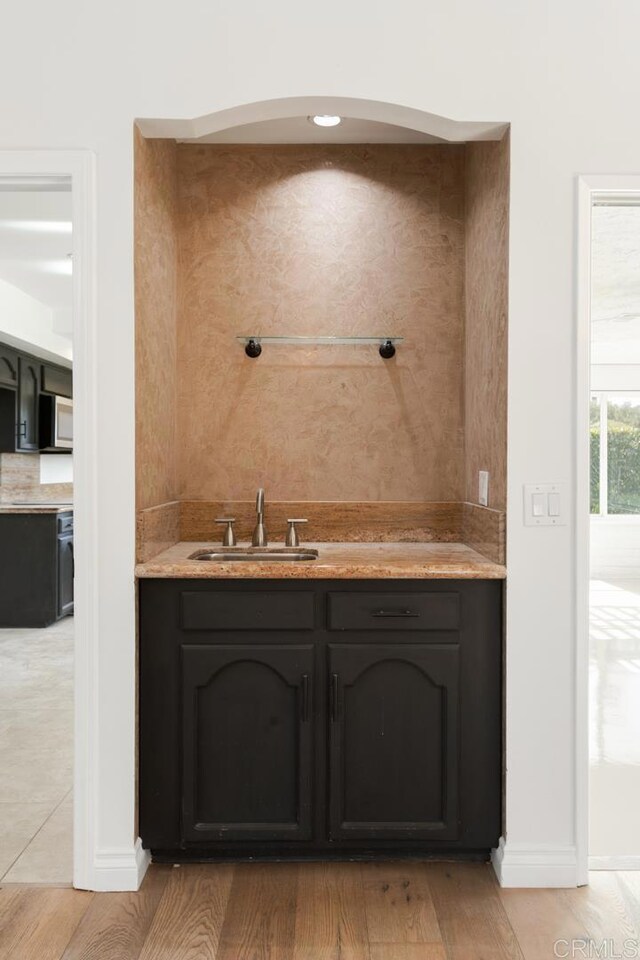 13837 Tam O Shanter Ct, Poway, CA 92064 - indoor wet bar featuring stainless steel microwave and light wood-style floors