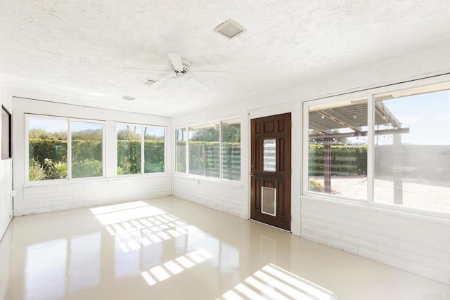 13837 Tam O Shanter Ct, Poway, CA 92064 - unfurnished sunroom with a ceiling fan, a textured ceiling, and brick wall