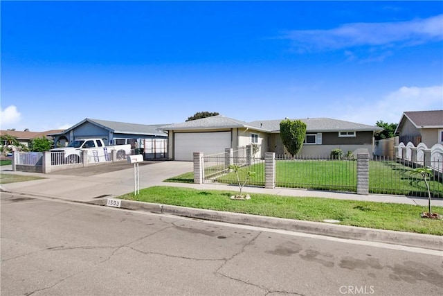 1593 W Carter St, Bloomington, CA 92316 - ranch-style home featuring a fenced front yard, driveway, a garage, and stucco siding
