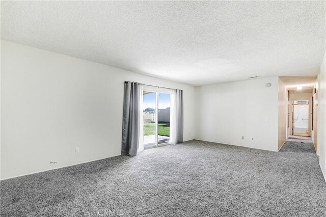 1593 W Carter St, Bloomington, CA 92316 - empty room with carpet floors and a textured ceiling