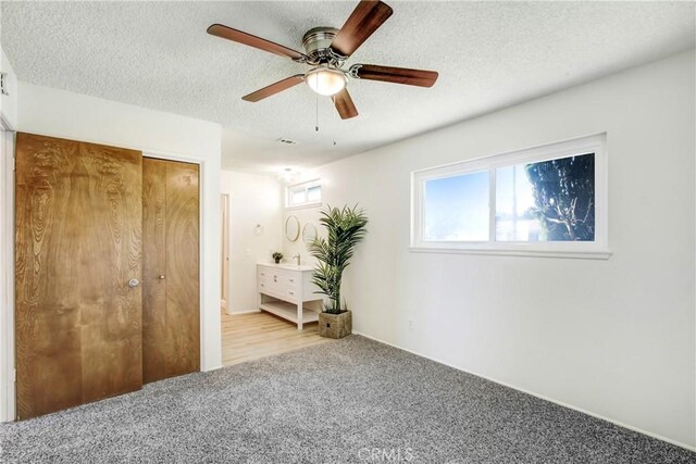 1593 W Carter St, Bloomington, CA 92316 - bedroom with carpet, a closet, a textured ceiling, and ceiling fan