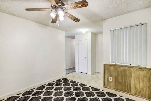 1593 W Carter St, Bloomington, CA 92316 - empty room with a textured ceiling and ceiling fan