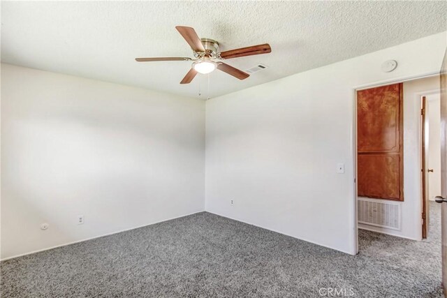 1593 W Carter St, Bloomington, CA 92316 - empty room featuring carpet flooring, ceiling fan, and a smoke detector