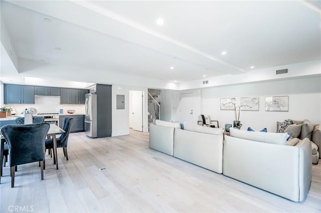 137 S Wilson Ave Unit 107, Pasadena, CA 91106 - living area with light wood-style floors, electric panel, stairway, and recessed lighting