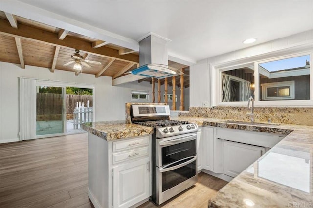 8123 Palm St, Lemon Grove, CA 91945 - kitchen featuring double oven range, island range hood, wooden ceiling, light wood-style floors, and white cabinets