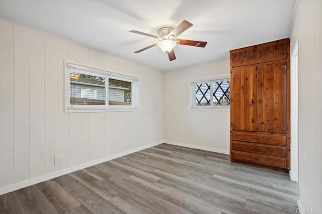 8123 Palm St, Lemon Grove, CA 91945 - unfurnished bedroom featuring wood finished floors and ceiling fan