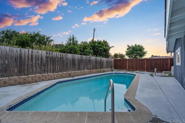 8123 Palm St, Lemon Grove, CA 91945 - pool at dusk featuring a patio and a fenced backyard