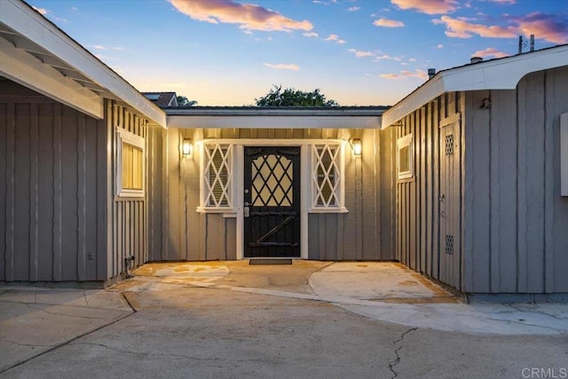8123 Palm St, Lemon Grove, CA 91945 - exterior entry at dusk with board and batten siding