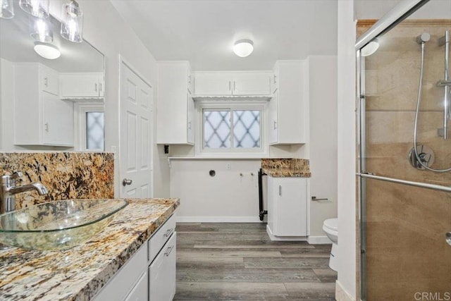 8123 Palm St, Lemon Grove, CA 91945 - bathroom featuring vanity, wood finished floors, and a shower stall
