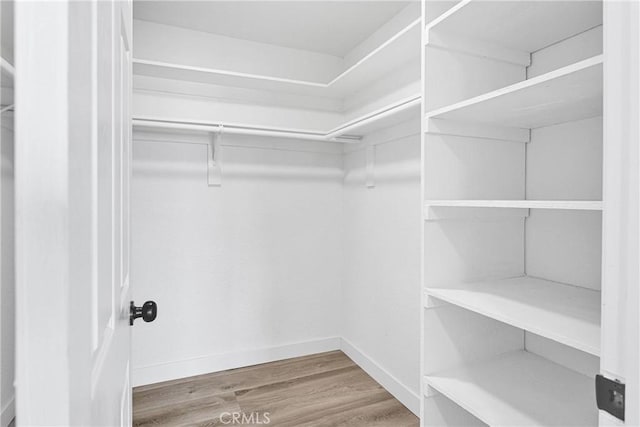 9546 San Pablo Ave, Hesperia, CA 92345 - spacious closet featuring wood finished floors