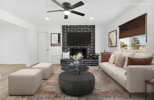 9546 San Pablo Ave, Hesperia, CA 92345 - living area featuring wood finished floors, a ceiling fan, a tile fireplace, and recessed lighting