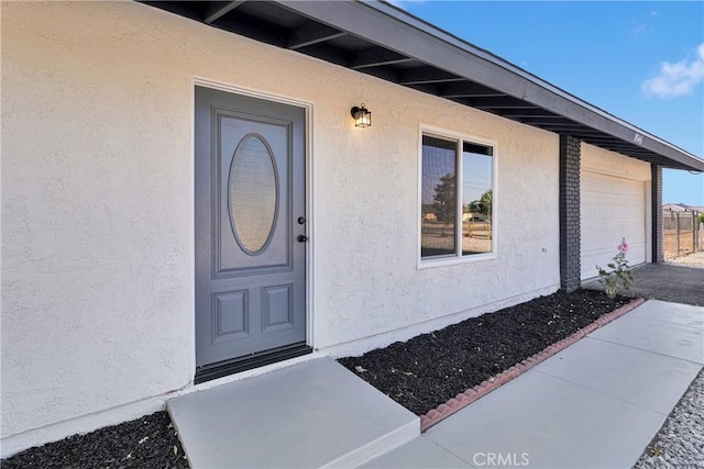 9546 San Pablo Ave, Hesperia, CA 92345 - property entrance with stucco siding and an attached garage