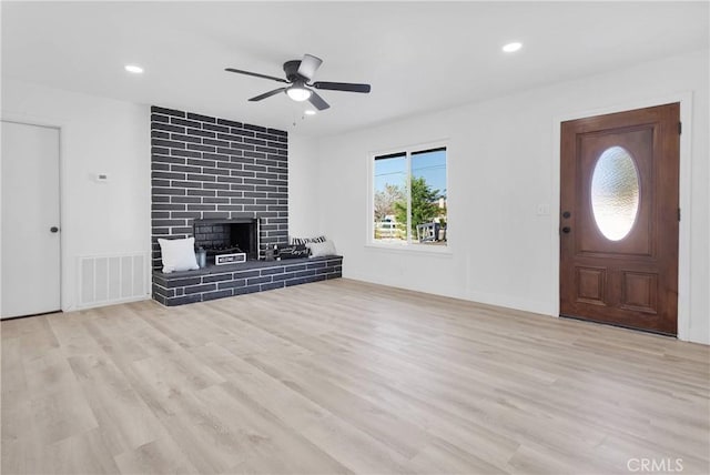9546 San Pablo Ave, Hesperia, CA 92345 - foyer featuring ceiling fan, wood finished floors, a large fireplace, and recessed lighting