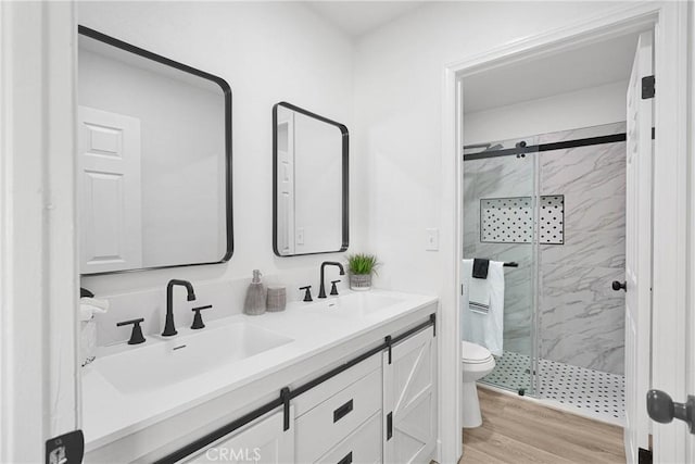 9546 San Pablo Ave, Hesperia, CA 92345 - bathroom with a marble finish shower, double vanity, and wood finished floors